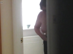 Excellent views of buxomy British milf dressing